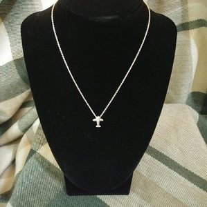 Silver necklace with tiny silver airplane pendant